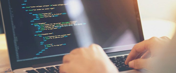 Woman using Sabre APIs to help develop travel software